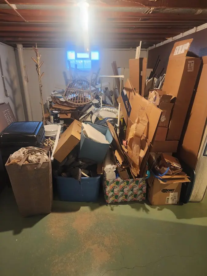 Roll-off dumpster container at job site for Concrete Dumpster Rental in Burton